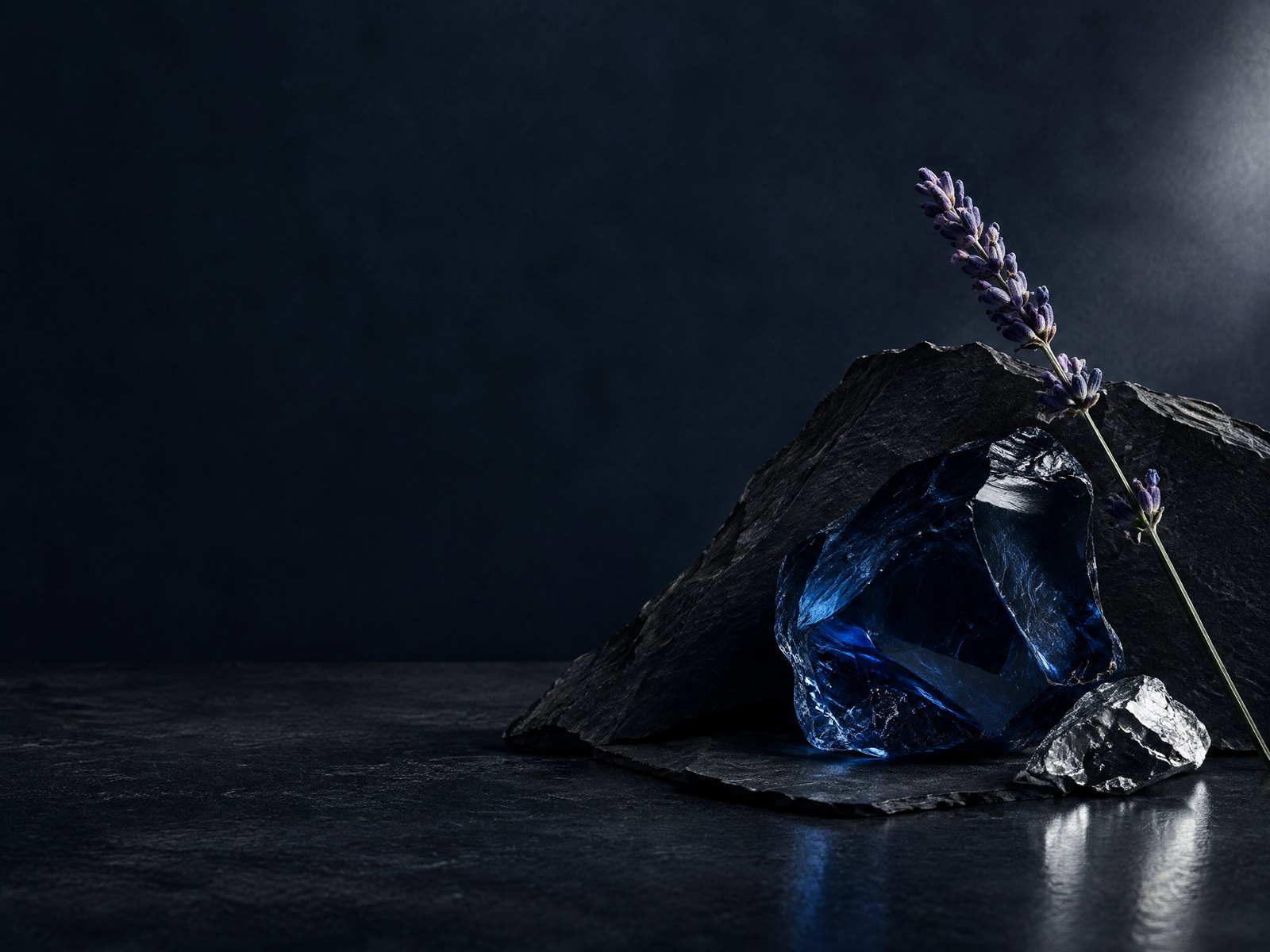 Midnight-blue mineral, black slate, and lavender editorial scent study